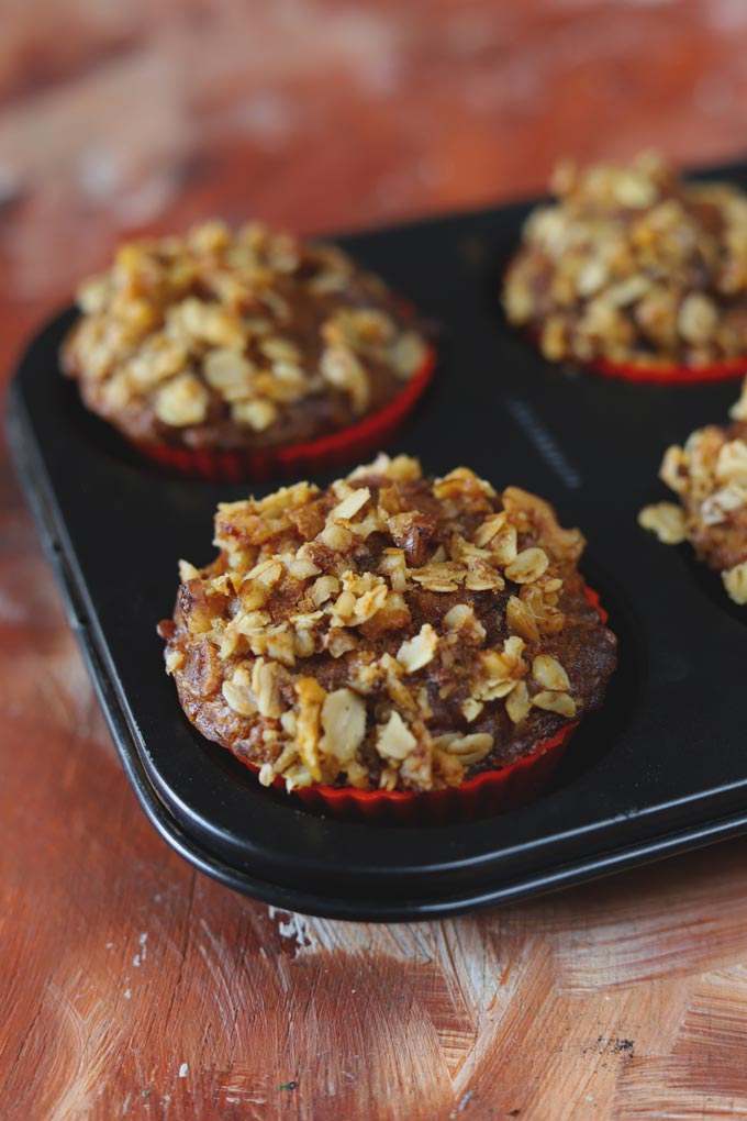 Apple Muffins With Crumbly Oats Streusel Topping in a Black Muffin Tray