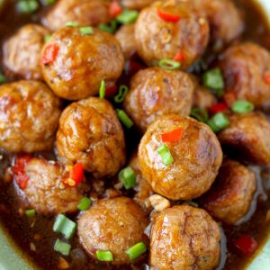 close up shot of Asian chicken meatballs in a serving bowl