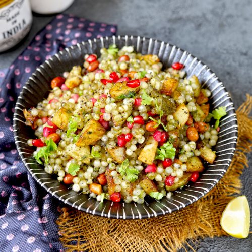 aerial shot of hariyali sabudana khichdi in a black ceramic bowl