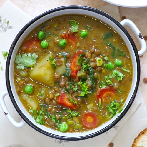 aerial shot of lentil stew in a white ceramic bowl