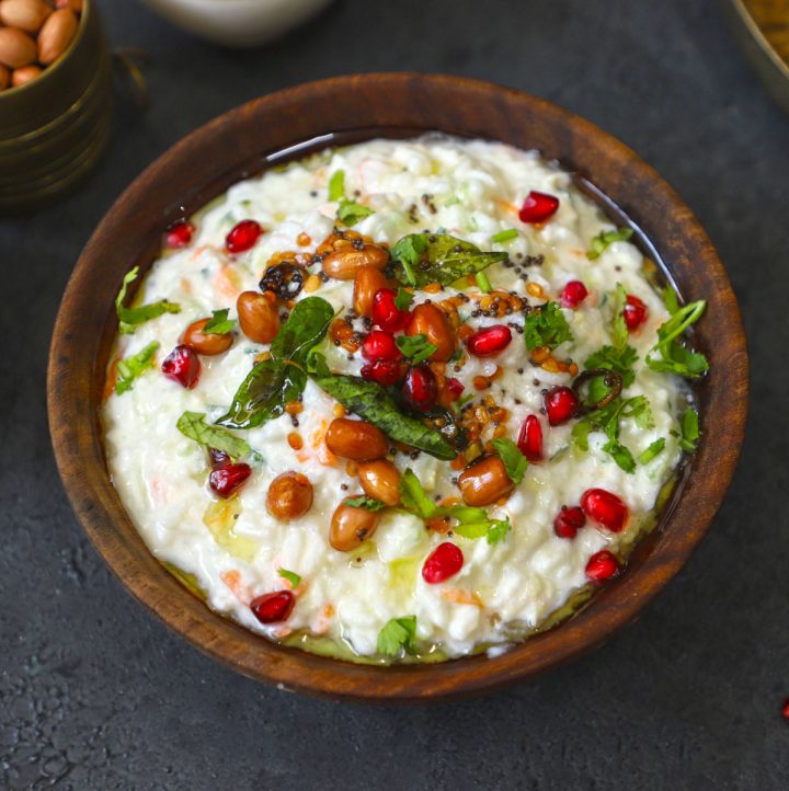 aerial shot of curd rice in a brown wooden bowl