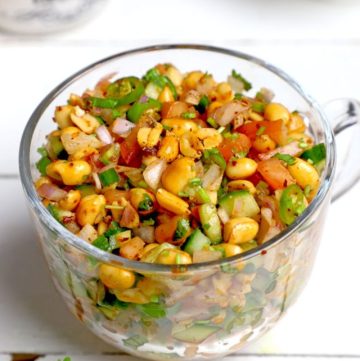 side shot of peanut chaat in a glass mug