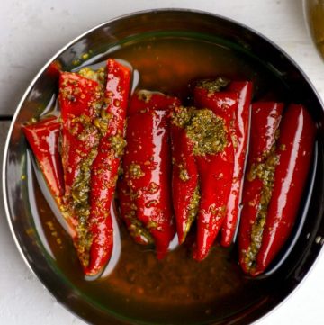 aerial shot of lal mirch ka achar in a stainless steel bowl