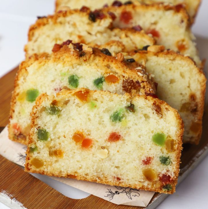 side shot of eggless tutti frutti cake on a platter