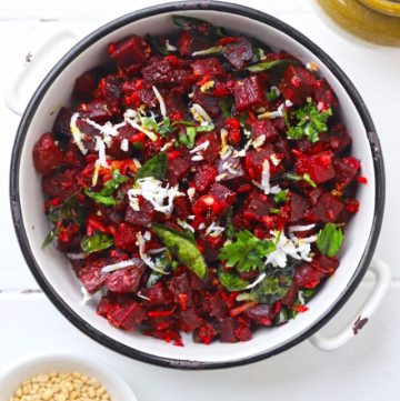 aerial shot of beetroot poriyal in a white ceramic bowl