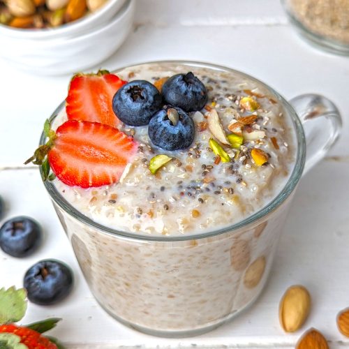 side shot of sweet dalia in a mug topped with chia seeds and fresh fruits