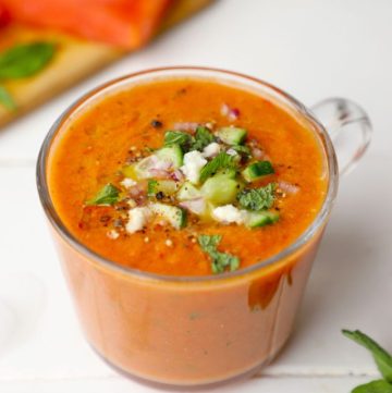 side shot of watermelon gazpacho in a glass mug