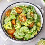 aerial shot of avocado salad in a white ceramic bowl