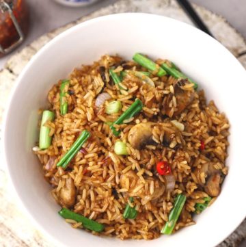 aerial shot of fried rice in a white ceramic bowl