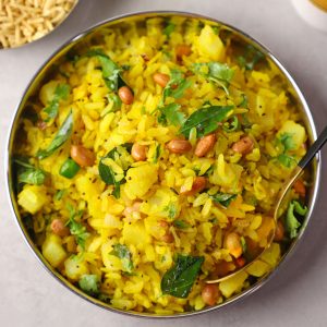 aerial shot of kanda poha on a stainless steel platter