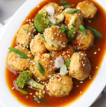 aerial shot of Asian chicken meatballs in a white platter