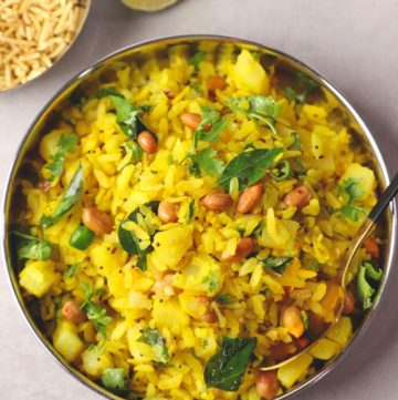 aerial shot of kanda poha in a stainless steel platter