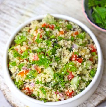 aerial shot of couscous salad in a white ceramic bowl