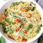 aerial shot of pasta with cherry tomato in a pan