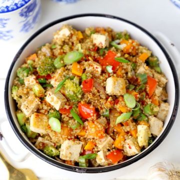 aerial shot of quinoa fried rice in a white ceramic bowl