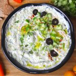 aerial shot of Greek cucumber sauce in a black bowl