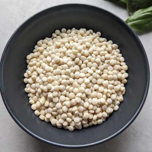 aerial shot of couscous in a black ceramic bowl