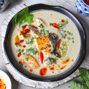 aerial shot of Thai coconut soup in a black bowl