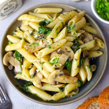 aerial shot of garlic mushroom pasta in a ceramic platter