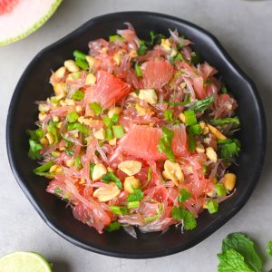 aerial shot of pomelo salad in a black bowl