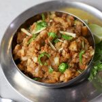 close up shot of singhada kachri in a stainless steel bowl