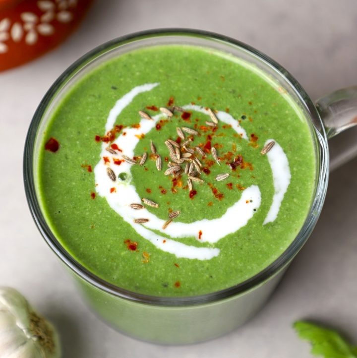 side aerial shot of spinach soup in a mug