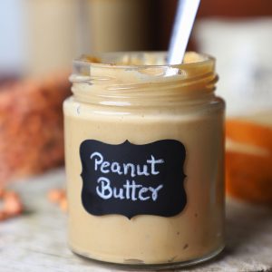 side close up shot of homemade peanut butter in a jar