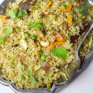 aerial close up shot of mint pulao on a platter